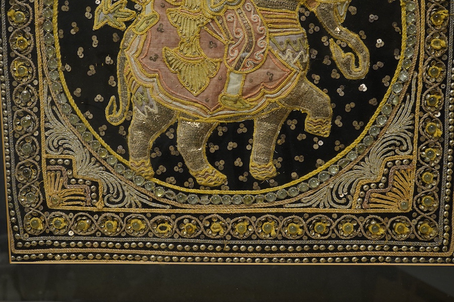 An Indian stumpwork panel of a figure and elephant